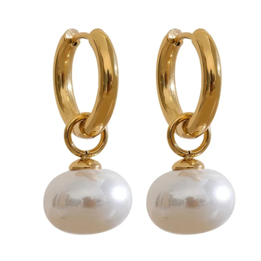 Close-up of Classic Korean hoop earrings with pearl charm, made from hypoallergenic stainless steel and plated with 18k gold.