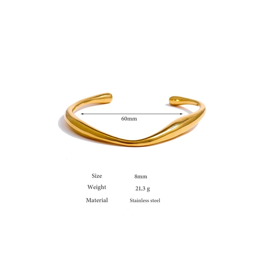 Minimalist Cuff Bracelet - Subtle Elegance. Crafted from hypoallergenic stainless steel, 18k gold plated, boasting a clean and sophisticated design. Versatile simplicity for enduring comfort and style.