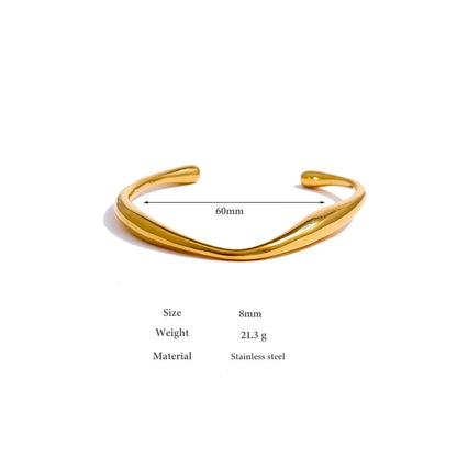 Minimalist Cuff Bracelet - Subtle Elegance. Crafted from hypoallergenic stainless steel, 18k gold plated, boasting a clean and sophisticated design. Versatile simplicity for enduring comfort and style.