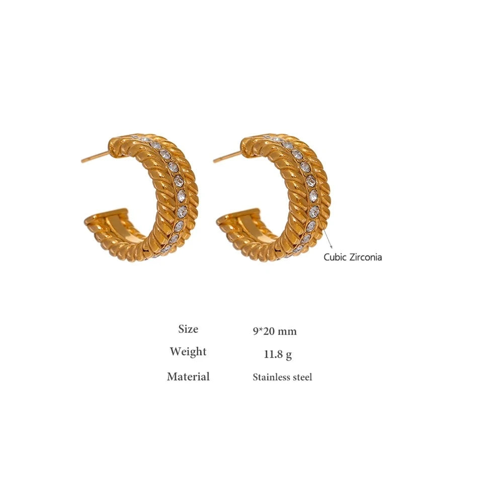 The C-Shaped Hoop earrings offer a modern and stylish look with their unique C-shaped design and sparkling zirconia embellishments. Crafted from hypoallergenic, eco-friendly stainless steel with a durable 18k gold plating, these earrings are both durable and sustainable, ideal for those who prioritize style and environmental consciousness.