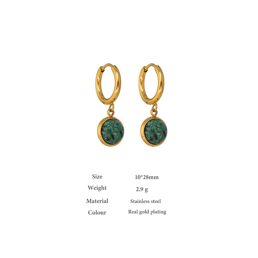 The Green Stone Charm Hoop Earrings exude majesty and elegance, reminiscent of the legendary stone of the African queen. Each green stone is delicately cut to enhance its natural beauty and vibrant hue, adding a touch of exoticism and sophistication to your look.