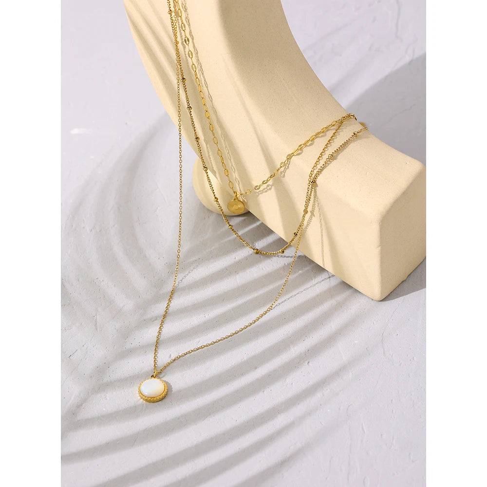 Multi Chain Bohemian Necklace - Boho Chic Elegance. Crafted from hypoallergenic stainless steel, 18k gold plated, featuring three chains and a round pendant. Blend of bohemian charm and contemporary style for versatile sophistication. Comfortable, durable, and sustainably crafted for enduring beauty.