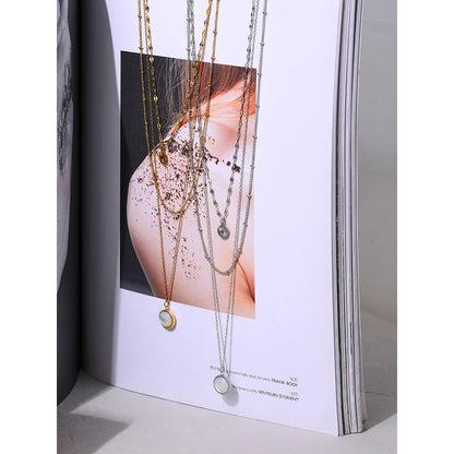 Multi Chain Bohemian Necklace - Boho Chic Elegance. Crafted from hypoallergenic stainless steel, 18k gold plated, featuring three chains and a round pendant. Blend of bohemian charm and contemporary style for versatile sophistication. Comfortable, durable, and sustainably crafted for enduring beauty.