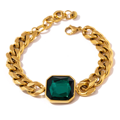 Emerald Chunky Chain Bracelet displayed on a white background, featuring a sturdy chain and a synthetic emerald, crafted from hypoallergenic stainless steel and plated with 18k gold