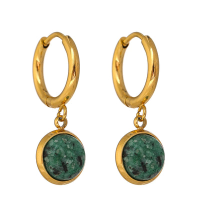 The Green Stone Charm Hoop Earrings exude majesty and elegance, reminiscent of the legendary stone of the African queen. Each green stone is delicately cut to enhance its natural beauty and vibrant hue, adding a touch of exoticism and sophistication to your look.65140