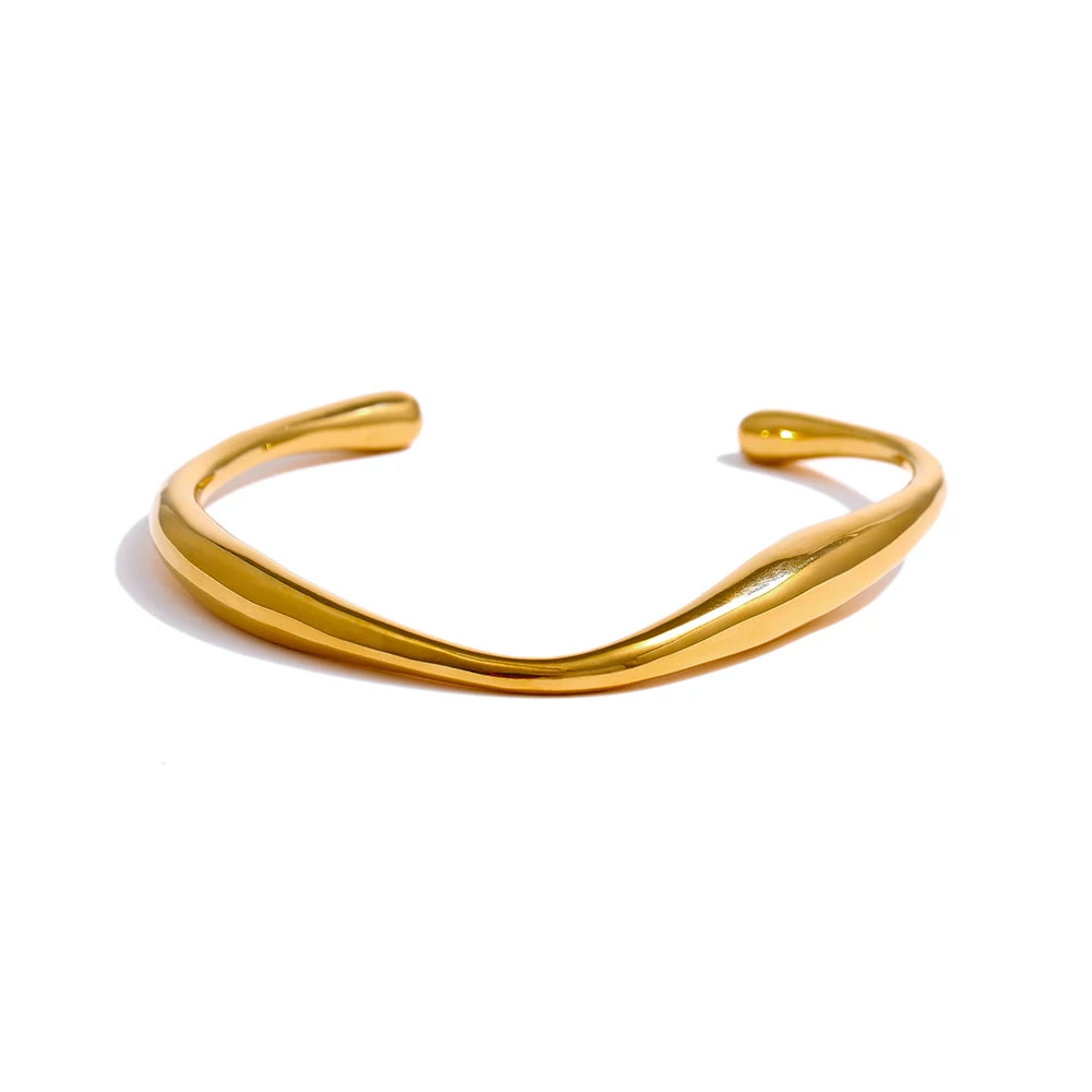 Minimalist Cuff Bracelet - Subtle Elegance. Crafted from hypoallergenic stainless steel, 18k gold plated, boasting a clean and sophisticated design. Versatile simplicity for enduring comfort and style.