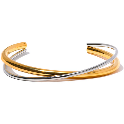 Double Color Cuff Bracelet - Contemporary Elegance. Crafted from hypoallergenic stainless steel, 18k gold plated, featuring dual silver and gold hues. Modern design for enduring elegance and comfort.