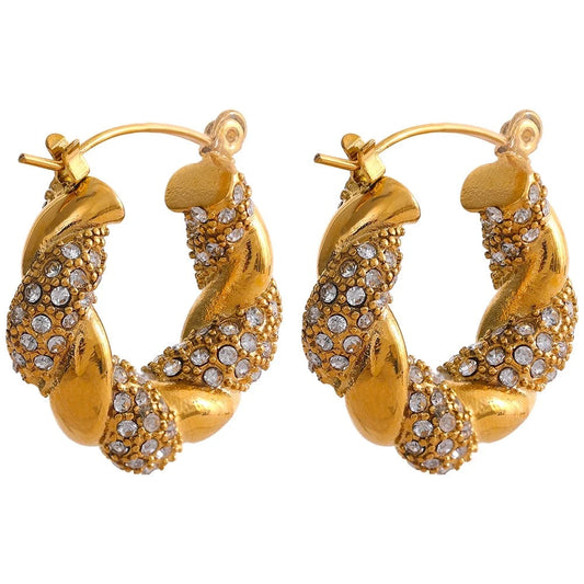 Gorgeous Twisted Hoop Earrings displayed on a white background, featuring a unique twisted design, crafted from hypoallergenic stainless steel and plated with 18k gold, adorned with studded zirconias