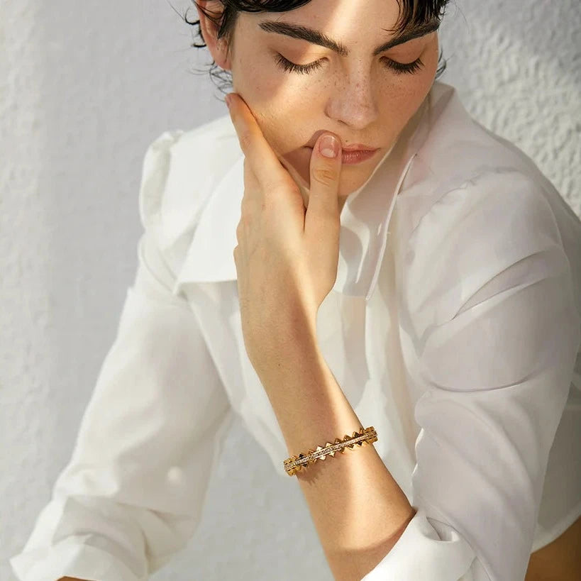 Model wearing the Avant-garde Pointed Bracelet, showcasing its bold and modern design, made from sustainable stainless steel with 18k gold plating