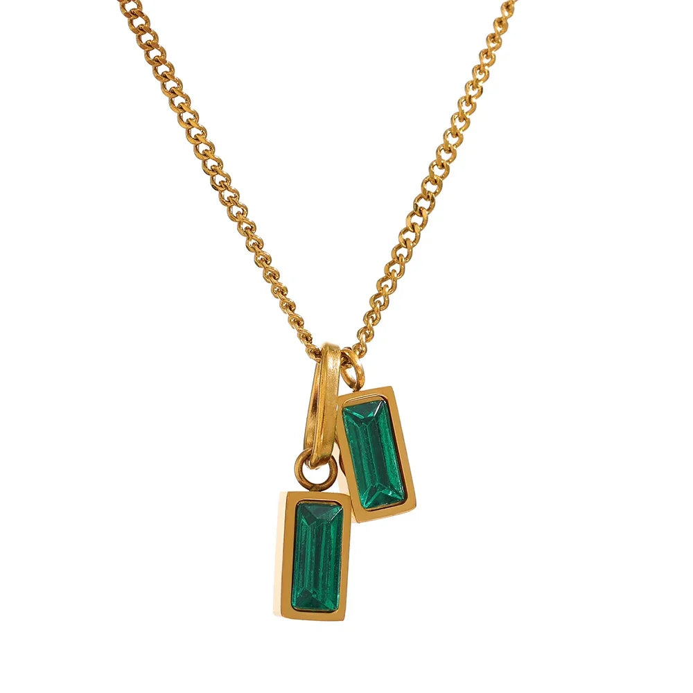 Add a touch of elegance to your look with our Green Duo Rectangle Pendant Necklace. Featuring two dazzling green zirconia pendants, this necklace is crafted from sustainable stainless steel and plated with 18k gold, merging style with eco-consciousness.