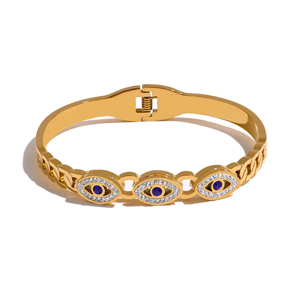 Triple Greek Eye Protection Bracelet displayed on a white background, featuring three Greek eyes adorned with cubic zirconias, crafted from hypoallergenic stainless steel and plated with 18k gold