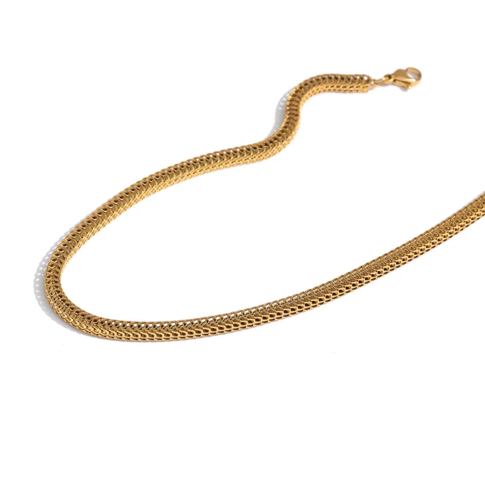 Introducing our Golden Scales Necklace - Mystical Elegance. Crafted from hypoallergenic stainless steel and plated with sustainable 18k gold. Inspired by dragon scales, featuring a captivating textured pattern. Versatile, adding glamour to any attire. Comfortable and enduring for daily wear.