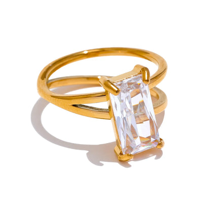 Illuminate your style with our Sunbeam Brilliance Ring. Crafted from sustainable stainless steel with an 18k gold coating, this ring boasts a large rectangular moissanite for a touch of radiance.