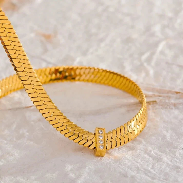 Close-up of the Basic Cuban Necklace, emphasizing the intricate wide Cuban chain design and the high-quality craftsmanship, made from hypoallergenic stainless steel with 18k gold plating.