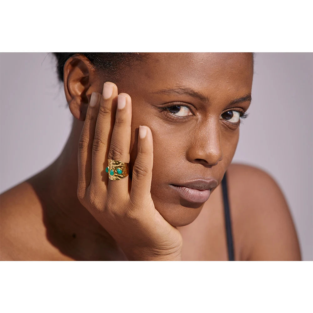 A model wearing the Rustic Green Trio Stone Ring, showcasing its rustic elegance and natural beauty.