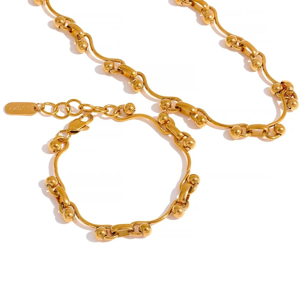 Exotic Quirky Chain Bracelet and Necklace Set, hypoallergenic stainless steel, 18k gold-plated, for elegance and durability.