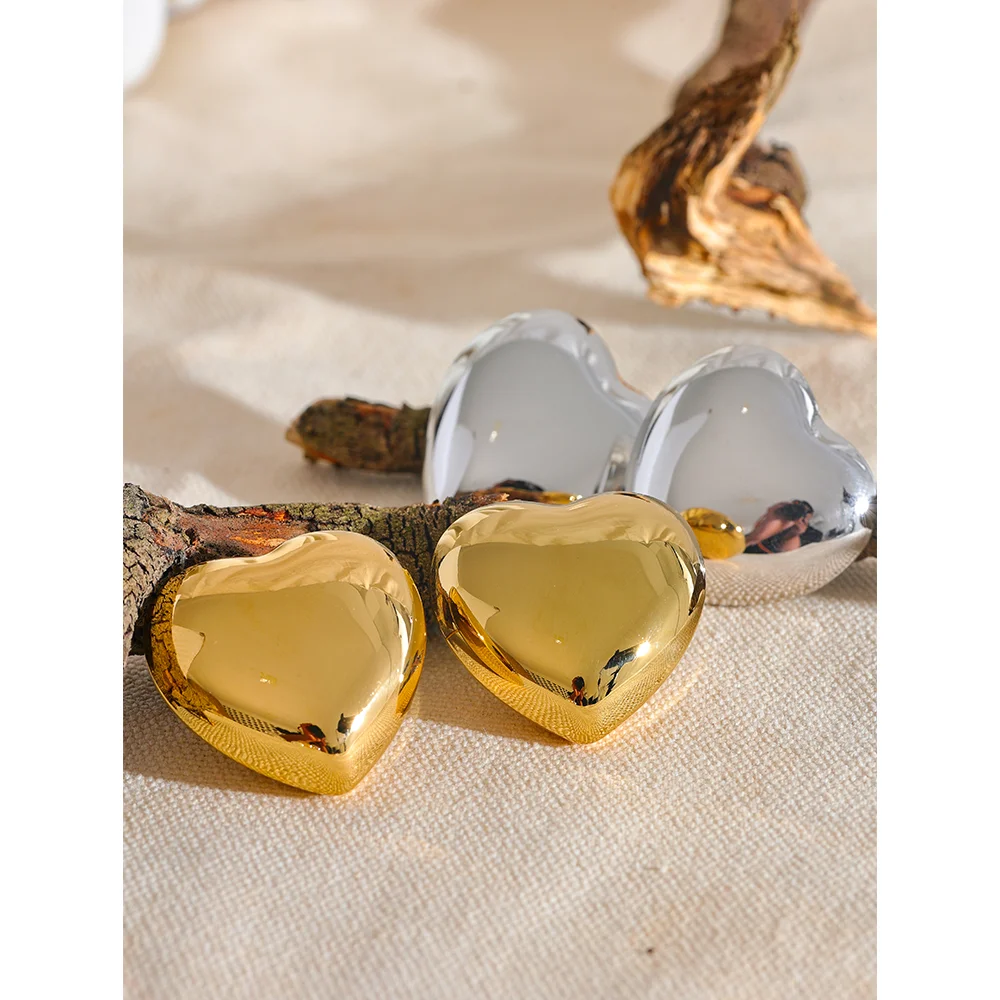 The Heart-Shaped Simple earrings feature a delicate heart-shaped design, expressing love and style with a minimalist aesthetic. Crafted from hypoallergenic stainless steel and plated with durable 18k gold, these earrings are sustainable and ideal for daily wear, adding elegance and meaning to any look.