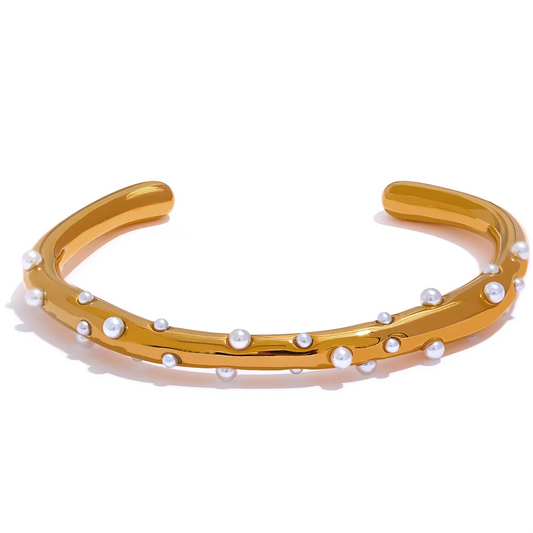 Elegant Pearl-Studded Cuff Bracelet - Timeless Sophistication. Crafted from hypoallergenic stainless steel, 18k gold plated, adorned with classic simulated pearls. Modern cuff design for enduring comfort and style.