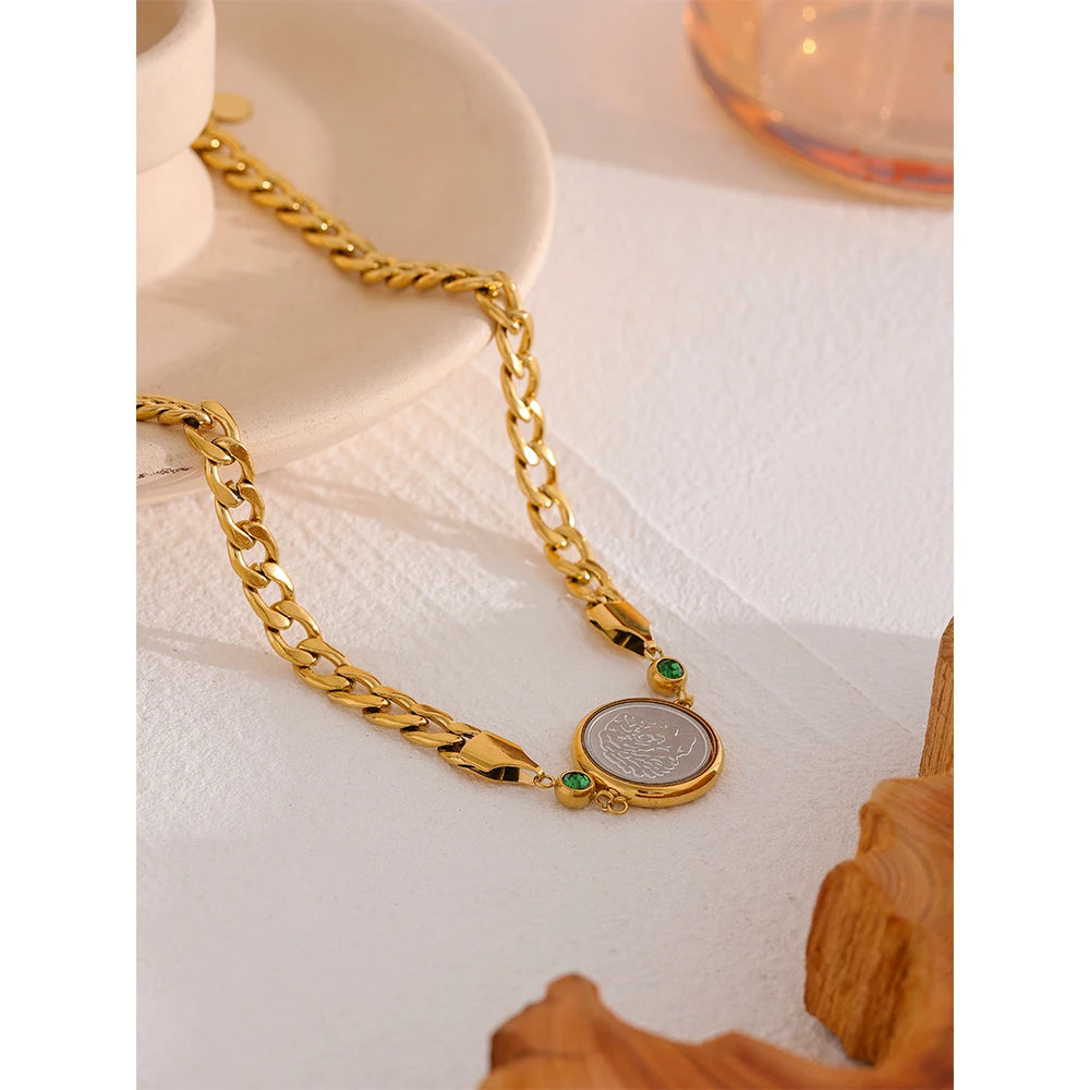 Introducing our African Coin Pendant Necklace - Celebrating Heritage. Crafted from hypoallergenic stainless steel and plated with sustainable 18k gold. Features an elegant African coin pendant on a sleek chain. Seamlessly blends tradition with contemporary style. Versatile for any occasion. Eco-conscious and enduring.