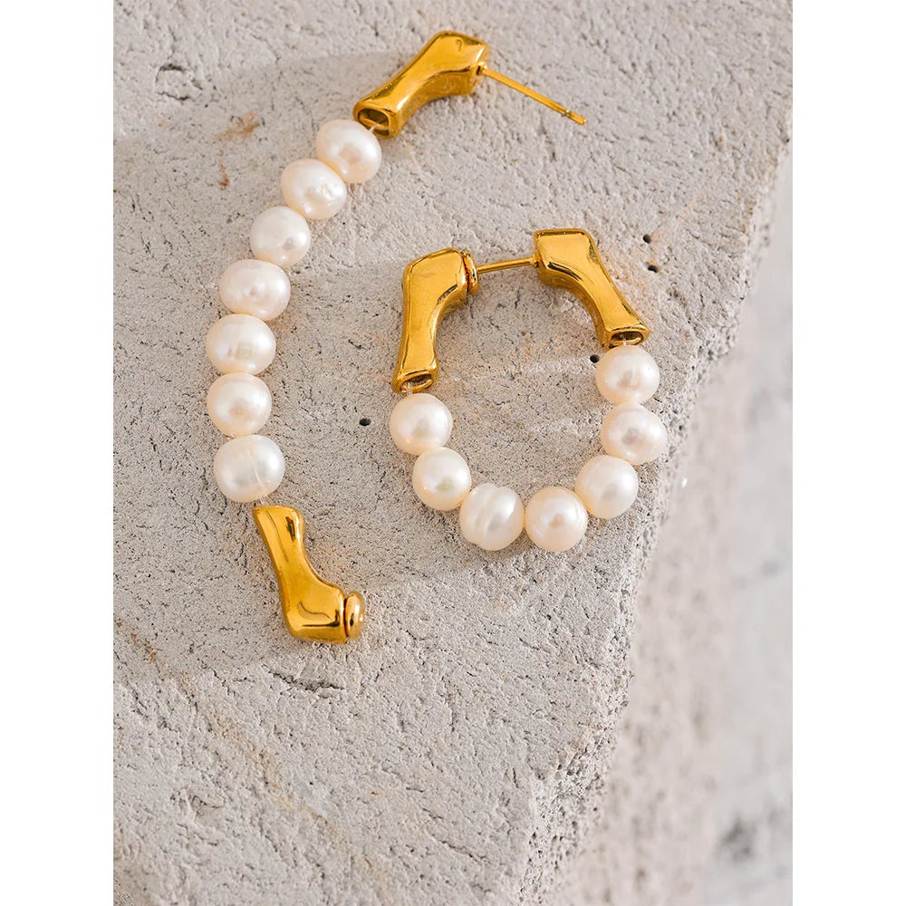 These exquisite earrings showcase a row of natural freshwater pearls, each selected for its exceptional quality, smooth iridescence, and luminous glow. Crafted from hypoallergenic stainless steel and plated with durable 18k gold, they embody elegance and luxury in every detail, reflecting light beautifully. Ideal for those seeking sophistication with a sustainable touch.